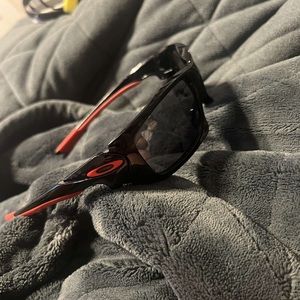 Black and red oakley sunglasses